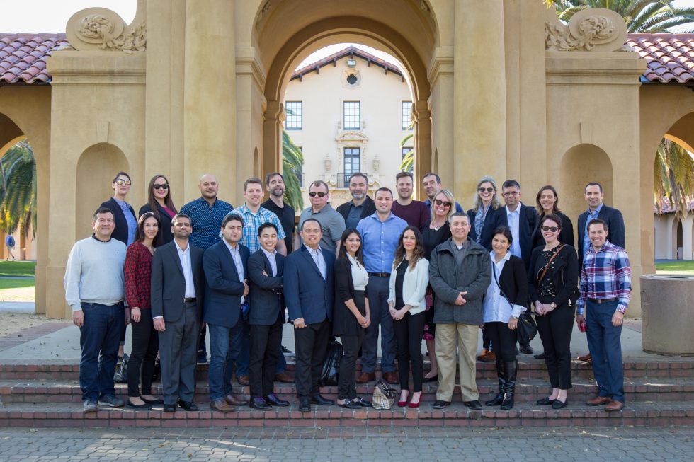 EMBA candidates and DeGroote faculty and staff pose at Stanford University’s Old Union, a hub for student activities on campus. photo by Bryan Mehi
