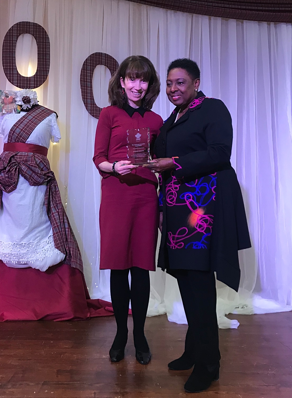 McMaster University Librarian, Vivian Lewis (left) with the Honourable Olivia Grange, Jamaica’s Minister of Entertainment, Sports, Culture and Gender Affairs at the Boonoonoonos Brunch, where McMaster was honoured for its stewardship of the Miss Lou Archive.