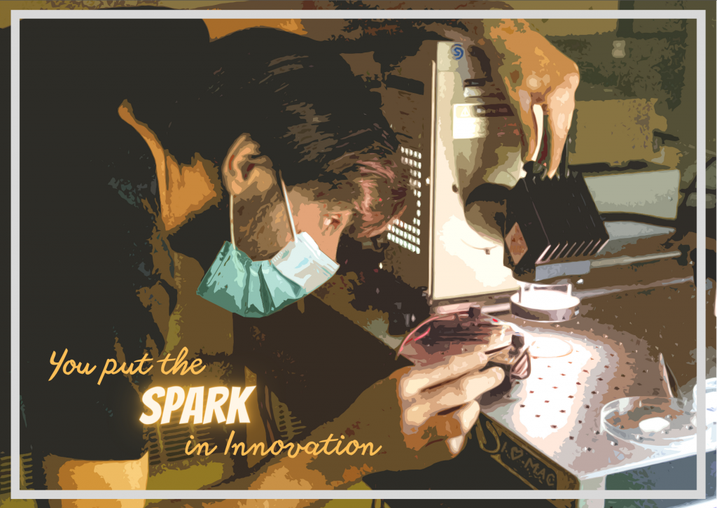 A Valentines postcard that reads 'you put the spark in innovation' and shows a McMaster engineering student examining an object under a light 