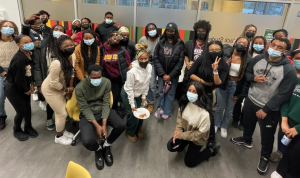 A group of masked students posing for a photo