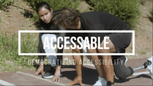 Two people crouched at the start line of a track. One has a prosthetic leg. 'The text AccessAble' is over the image. 