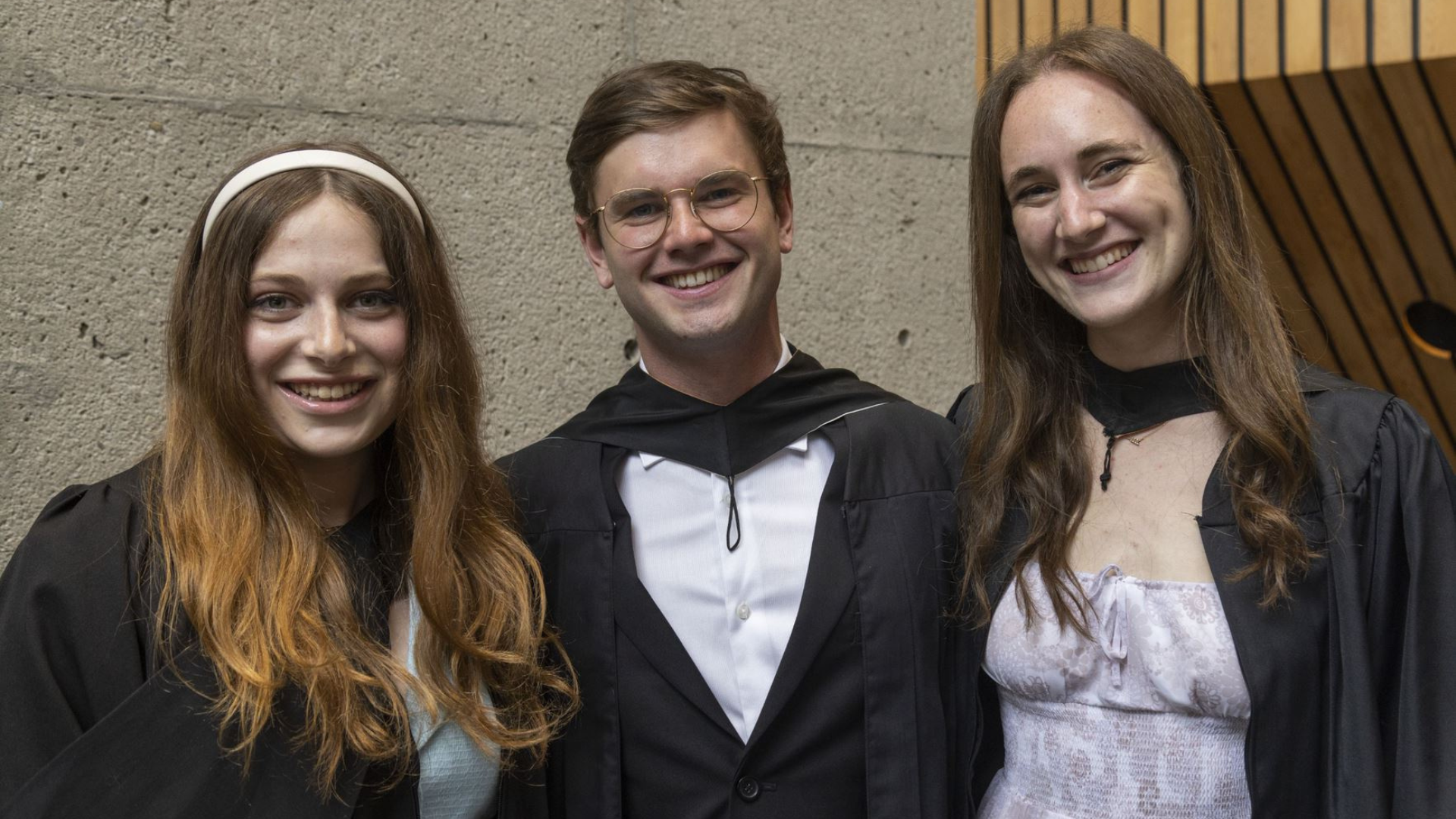 Graduates Ariella Ruby, Jerry Miller and Gillian Maltz smiling at the camera