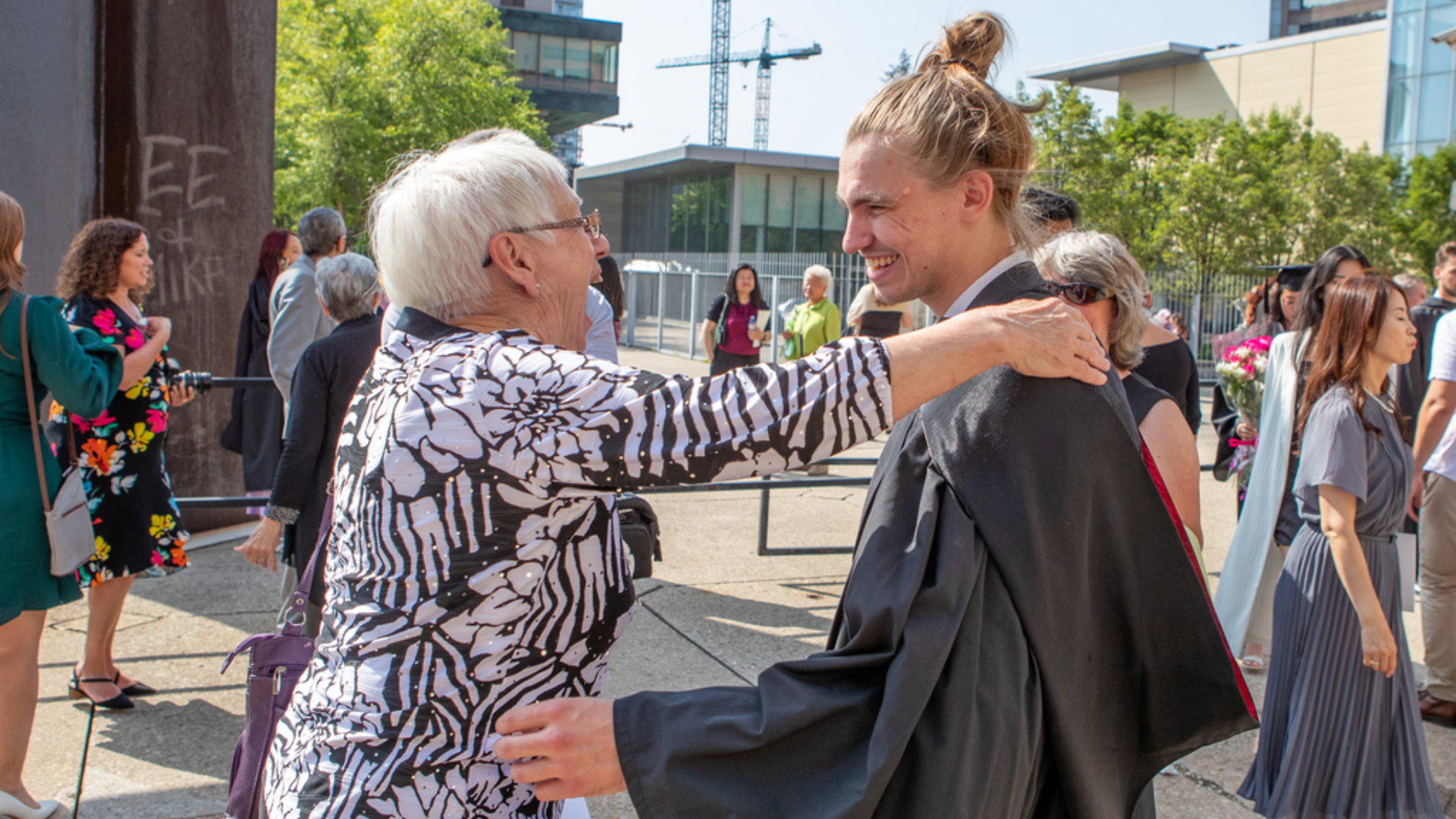 Isaac Crawford's grandmother puts her arms out to hug her grandson