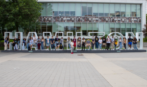 Ignite students pose with the Hamilton sign outside City Hall