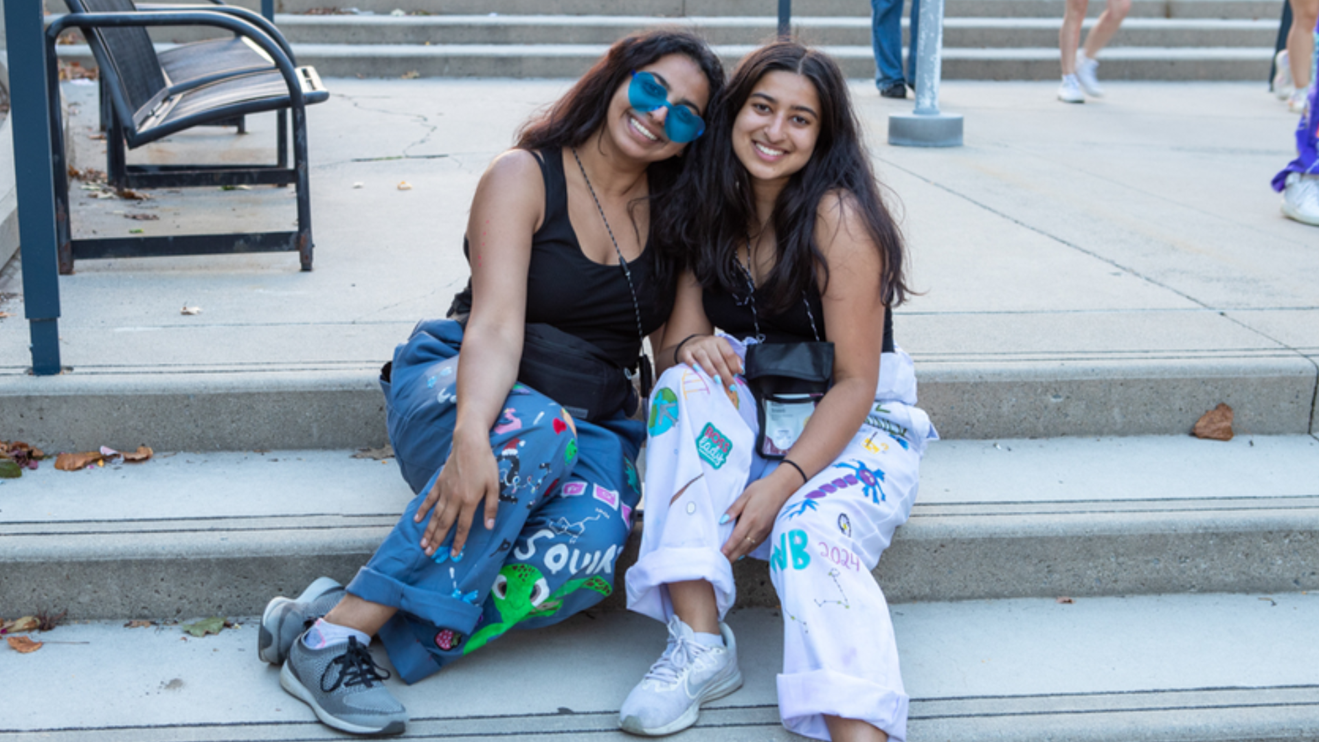 Two students wearing rep gear posing for a photo