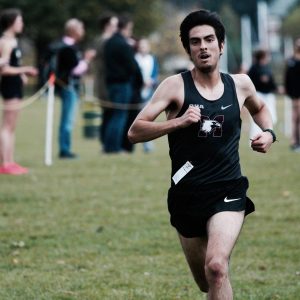 Sergio Raez-Villanueva running while wearing a Marauders tank top