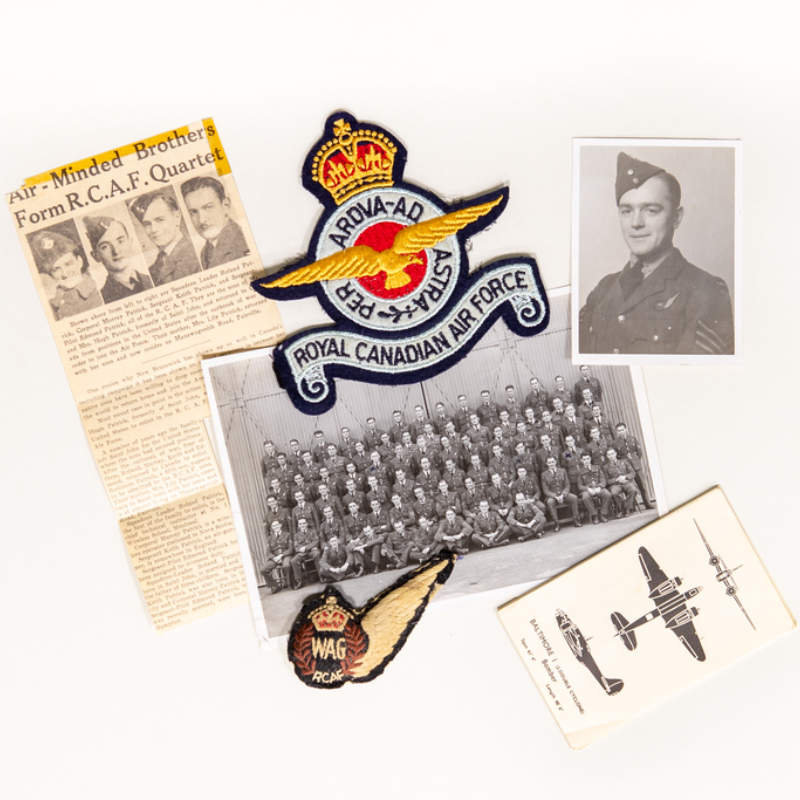 A newspaper clipping, two photos, a handbook and two badges set against a light grey backdrop. 