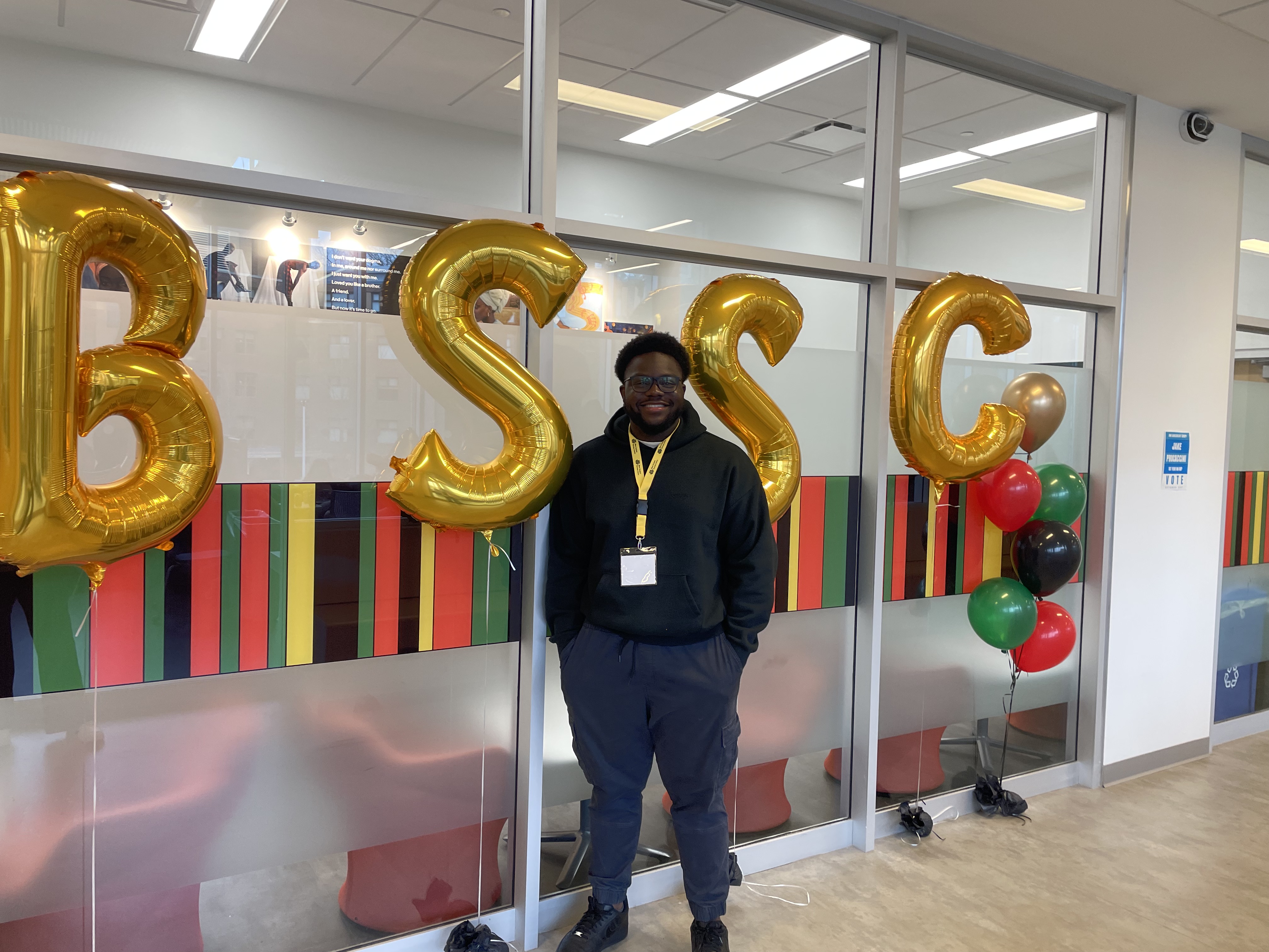 Toluwalase Dayo-Olaide standing in front of McMaster's Black Student Success Centre