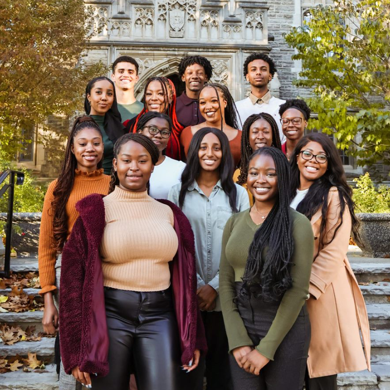 A group of students posing for a photo on McMaster's campus