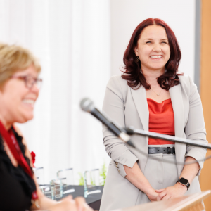 Lindsay Bolan laughing. Faculty of Engineering Dean Heather Sheardown can be seen in the foreground.