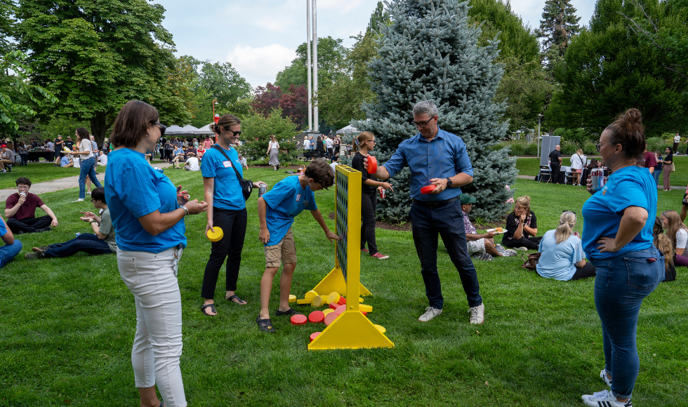 People play an enormous game of Connect 4 on BSB field at the employee picnic.