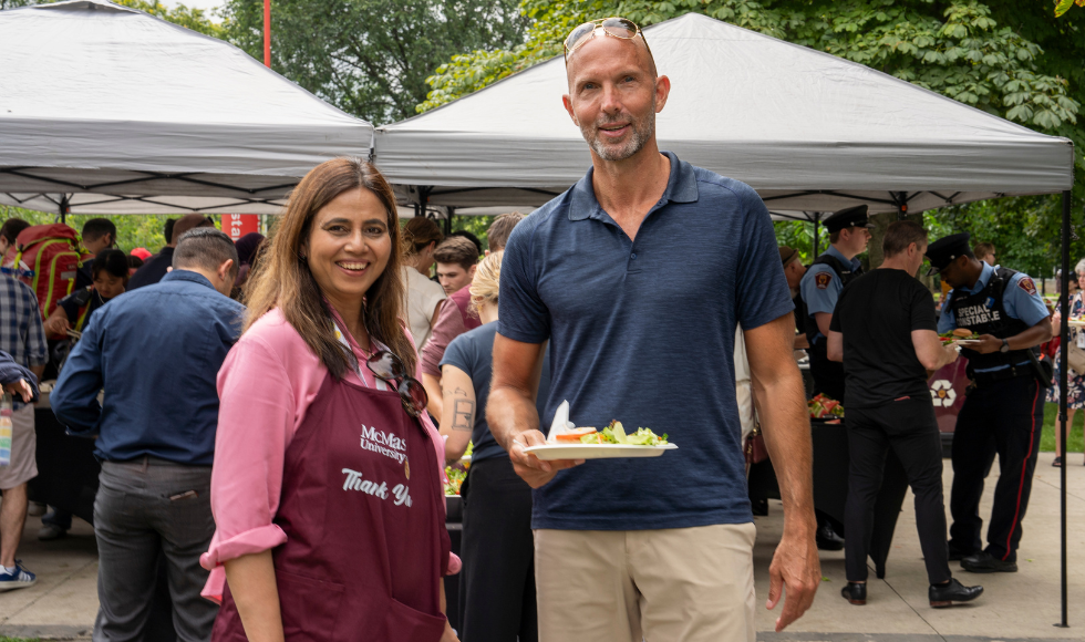 Saher Fazilat and Sean Van Koughnett smile at the employee picnic.