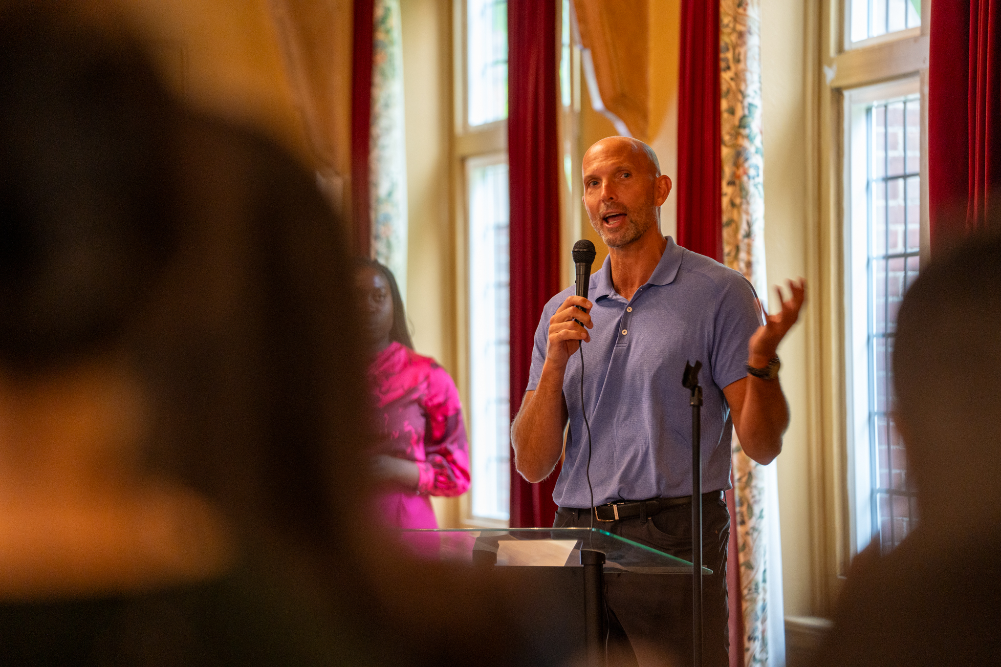 Sean Van Koughnett speaking into a microphone