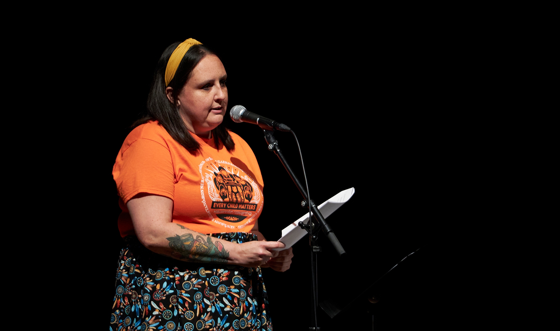 Chrissy Doolittle speaking at a mic