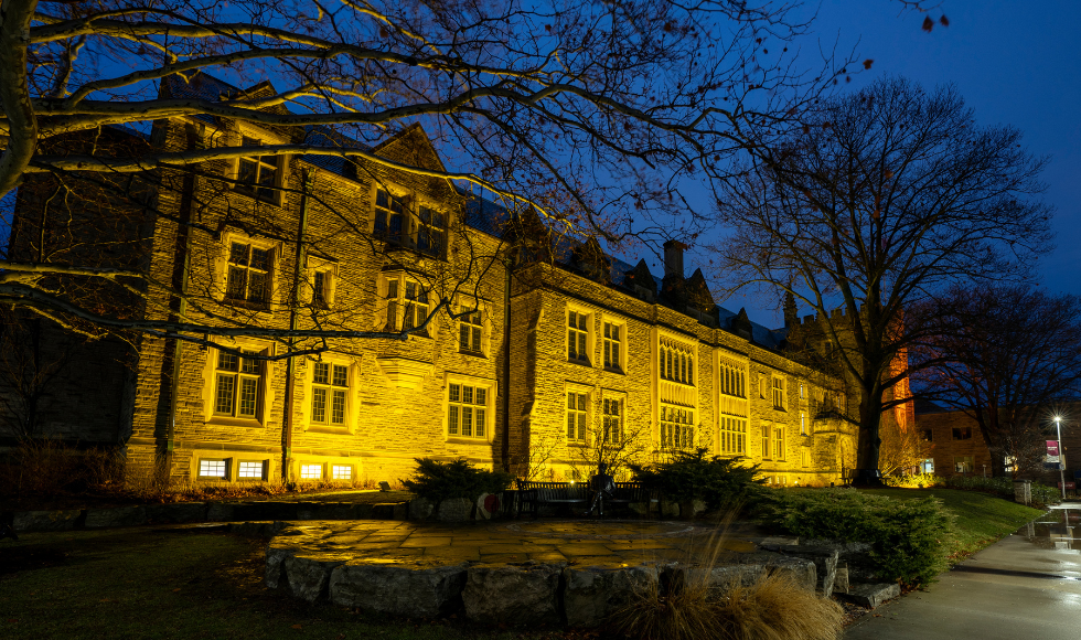 McMaster's University Hall lit up with yellow lights