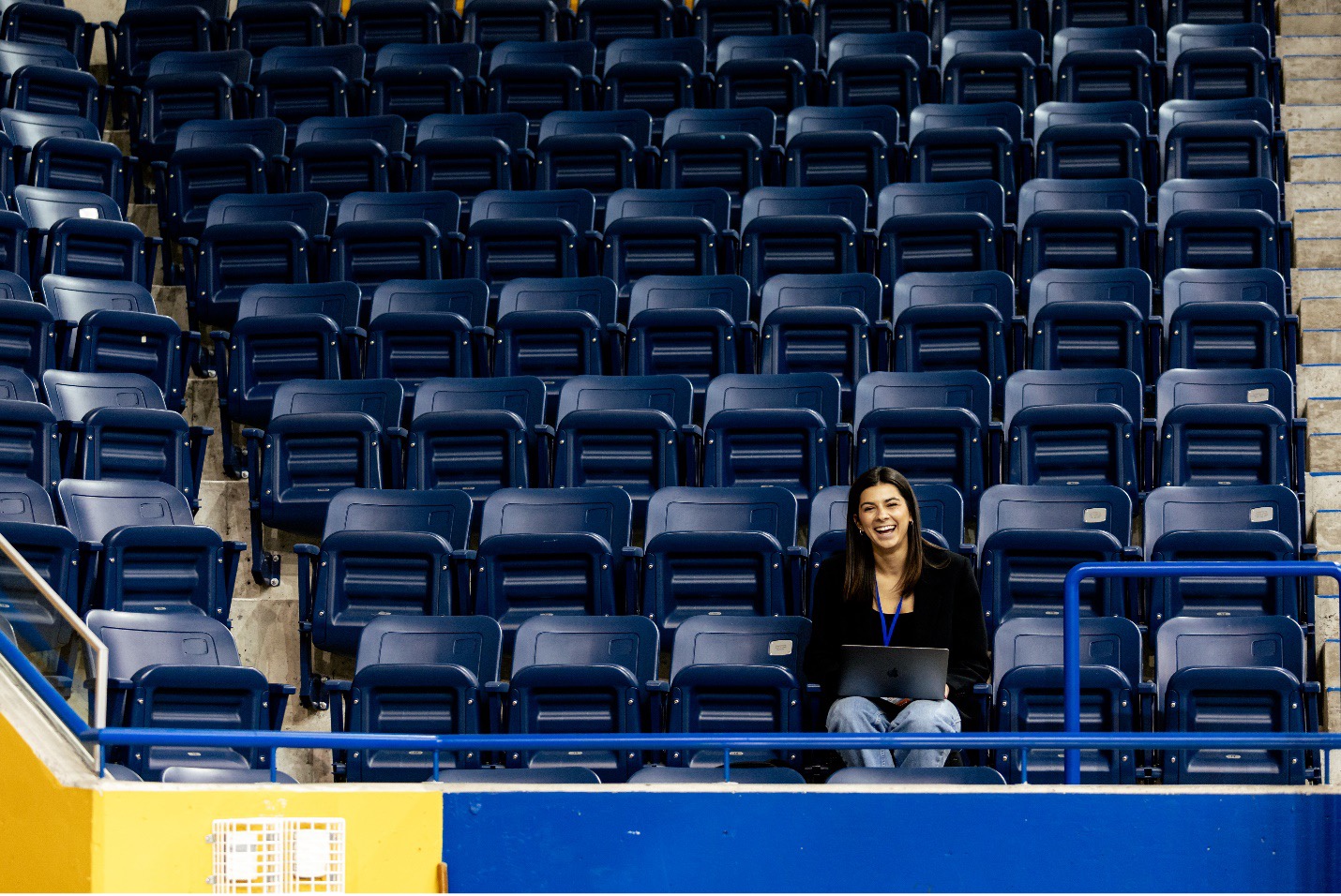 Mackenzie Barwell sitting in the stands of a game.