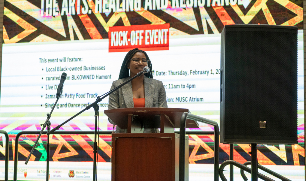 Eve Nyambiya speaks into a mic at BHM at Mac launch event 2024