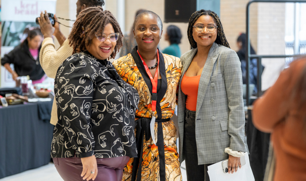 Library DEIA strategist Crystal Mark, BSSC head Faith Ogunkoya and BHM at Mac coordinator Eve Nyambiya smile together at BHM at Mac launch event 2024