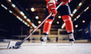 A hockey player, seen from ice level.