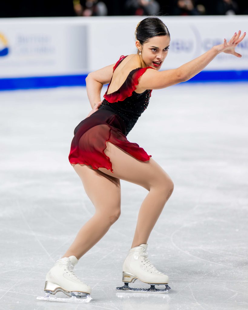 Madeline Schizas smiles as she skates
