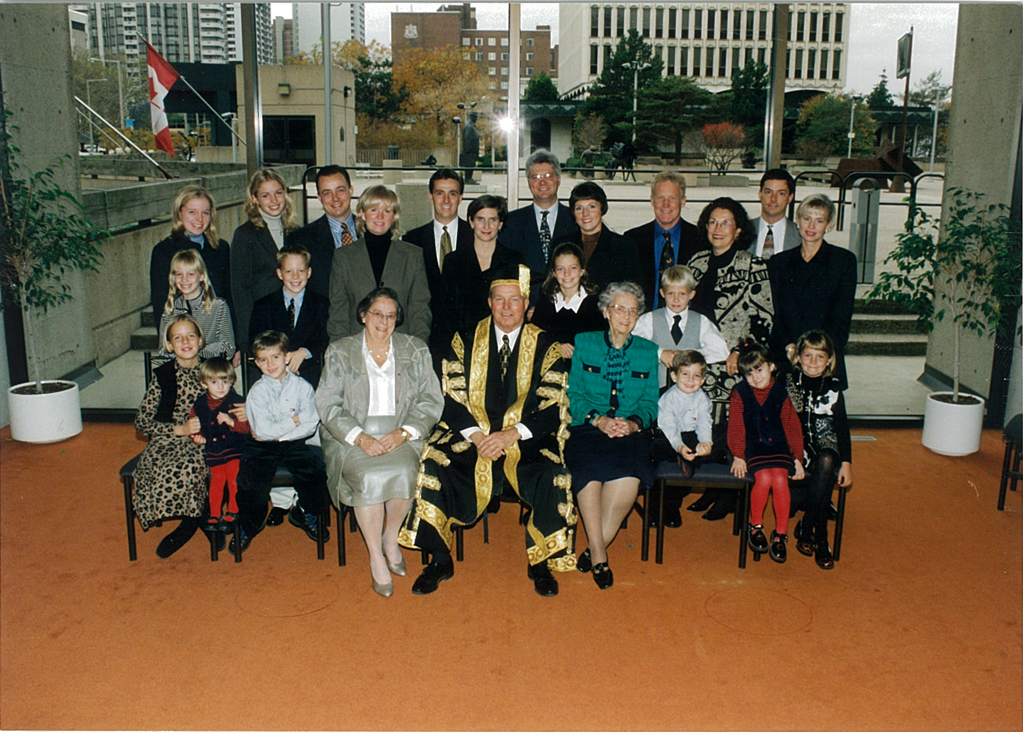 A large family, and seated at the centre is Mel Hawkrigg in McMaster's Chancellor's robes.