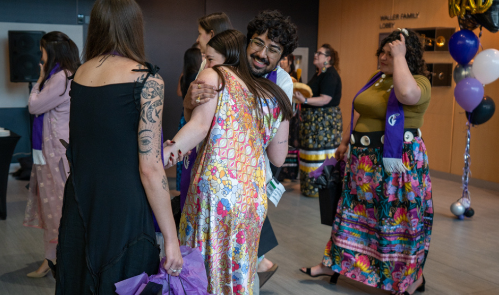 Students hug in the Waller lobby