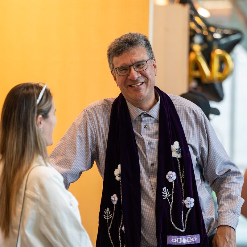 Rick Monture smiles during a conversation