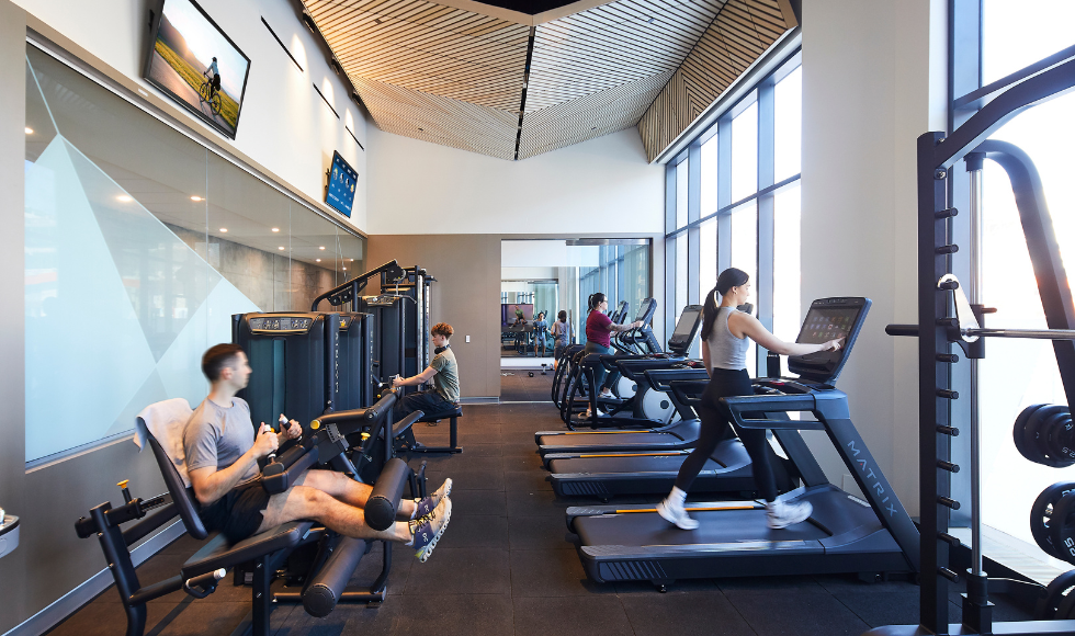 Four people working out in a gym