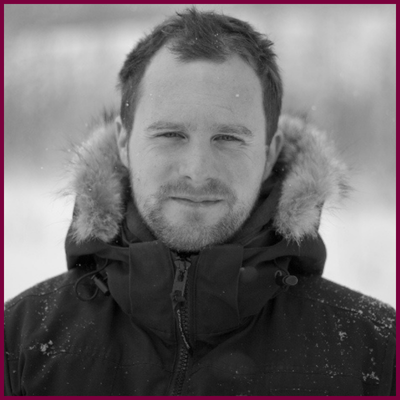 black and white headshot of wayne wapeemukwa, wearing a parka