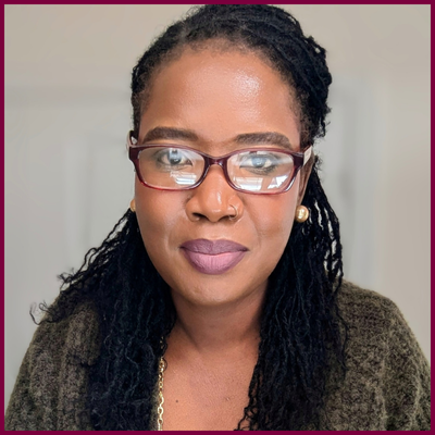 Headshot of a woman wearing glasses.