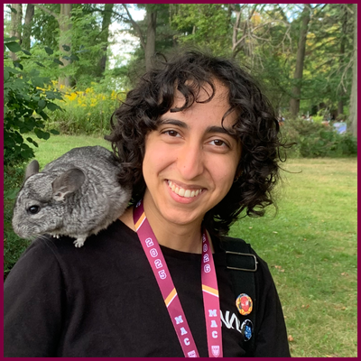 Anika Yadav, with a chinchilla on her shoulder.