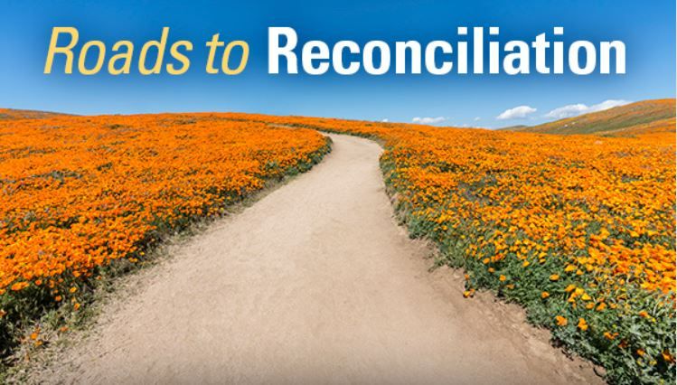 A graphic that reads ‘Roads to Reconciliation,’ and features a photo of a pathway in a meadow