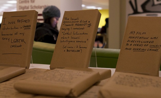 The Freedom to Read display by the elevators at Mills Library showcases a number of books, symbolically covered in brown paper, that have been banned, challenged, or censored for any number of reasons, including sexuality, coarse language, racism, or religious objections.