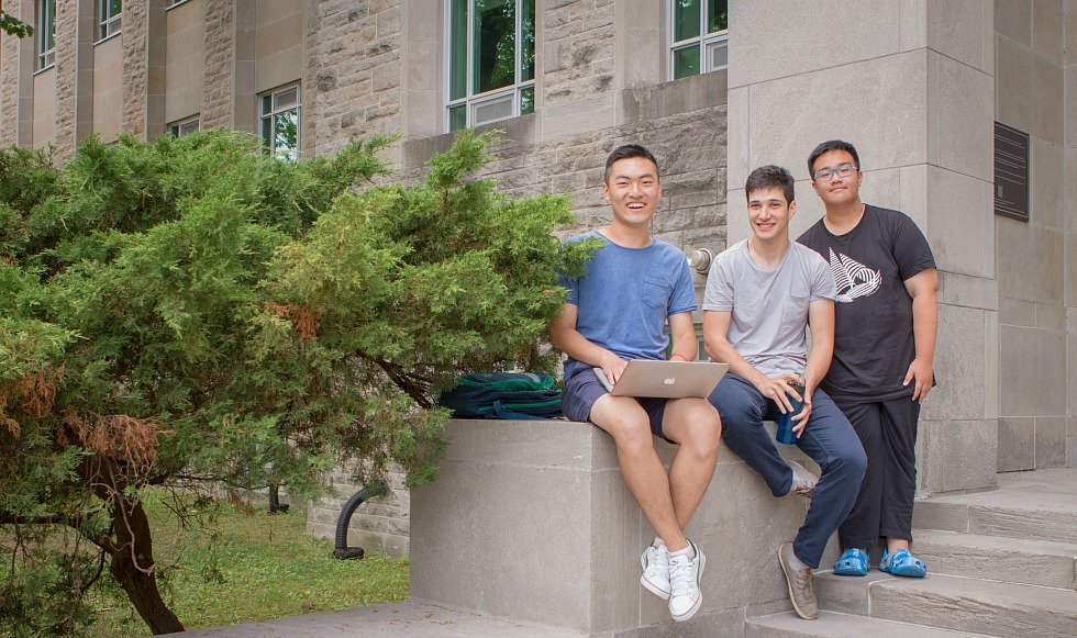 (Left to right) SummerESL@Mac volunteer David Sun, McMaster student and SummerESL@Mac Program Assistant Yahya Ikbal Ayadin, and SummerESL@Mac student Edward Sun take a break from the English language training program, which Edward Sun says has been a ‘wonderful experience.’