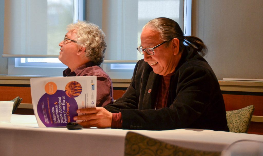 Tim Thompson, left, and Amos Key Jr. at a panel discussion on Indigenous languages at the MIRI symposium in March 2018