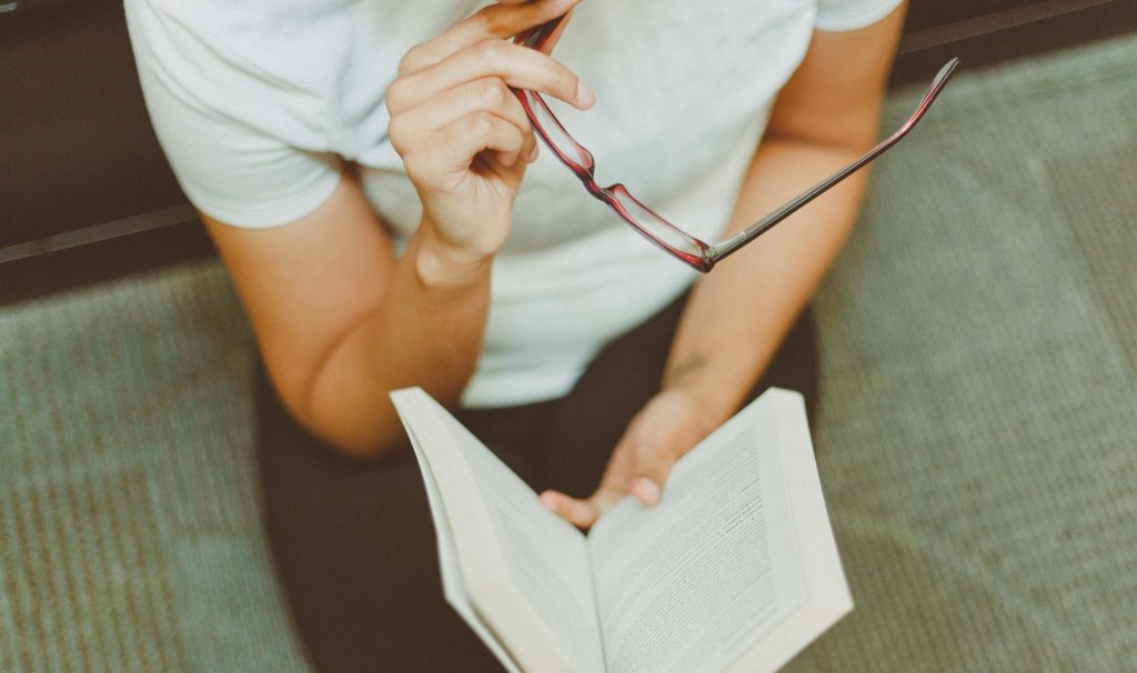 Stock image of woman reading a book