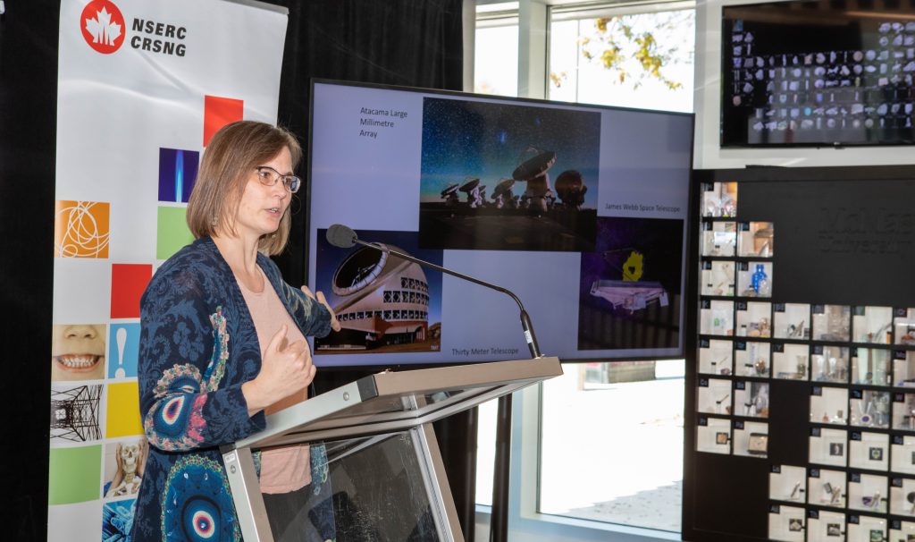 Astronomy professor Allison Sills explains her work with a photo presentation at the announcement of $588 million in new NSERC Discovery Grants.