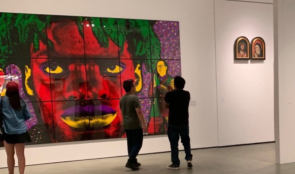 Gallery visitors stand in front of a five-foot tall piece of art called Heady, which is part of the Levy Bequest purchance in 1995.