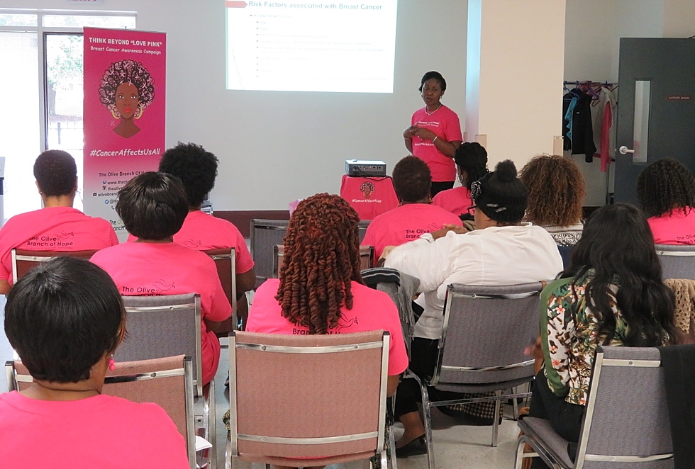 McMaster researcher Juliet Daniel’s former trainee, Dr. Blessing Bassey-Archibong – now a McMaster postdoctoral student – gives a breast cancer awareness presentation at the inaugural Think Beyond Love Pink workshop in October 2016.