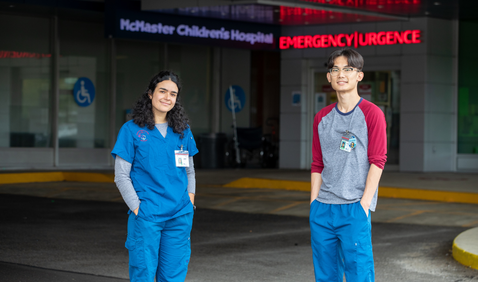 Two nursing students standing outside a hospital