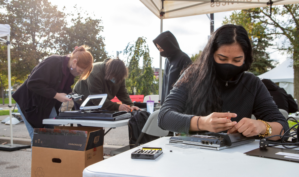 students sort through donated technology.