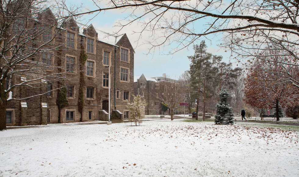 campus historic buildings with snow covering a large open space in front of the buildings