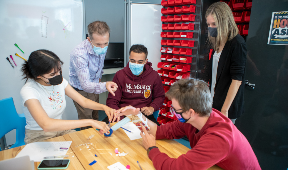 Researcher Colin McDonald and teaching assistant Kyla Sask, along with students Ahmed Alduuyher, Johnny Malcolm and Rimsha Malik inside a classroom at McMaster University.