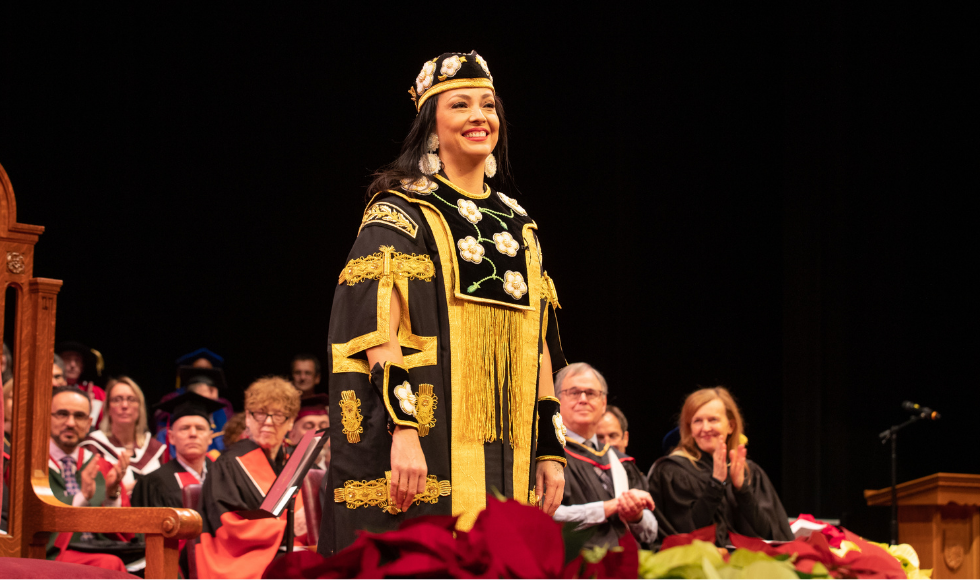 Santee Smith wearing the Chancellor's ornate robe and hat at convocation