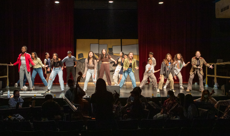 A group of students performing on a stage