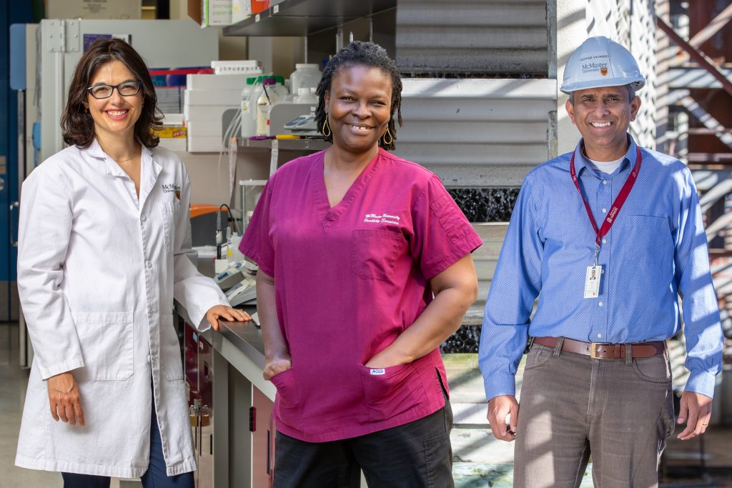 McMaster employees working across a variety of campus settings in 2021. From left to right: Dawn Bowdish, professor in professor in the Faculty of Health Sciences, Madeleine Agboton Neville, custodian with McMaster Facility Services and George Vadakken, Acting Director of Maintenance Services.