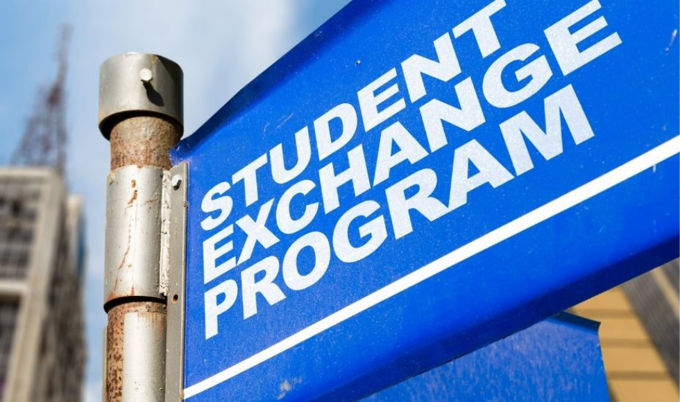 A blue sign reading "Student Exchange Program"