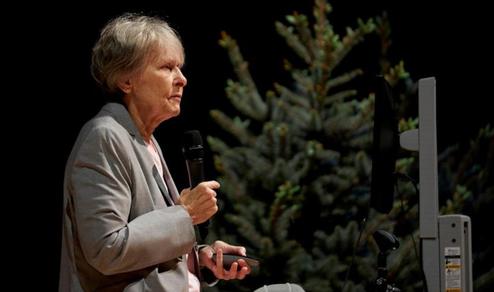Roberta Bondar standing onstage delivering a talk at McMaster University