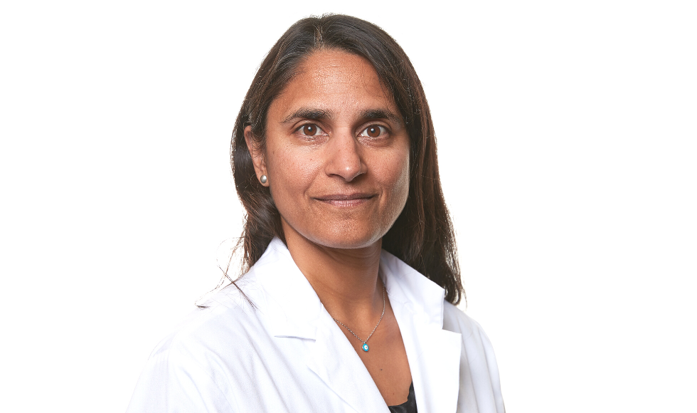 Sonia Anand head and shoulders headshot on white background. She is wearing a lab coat.