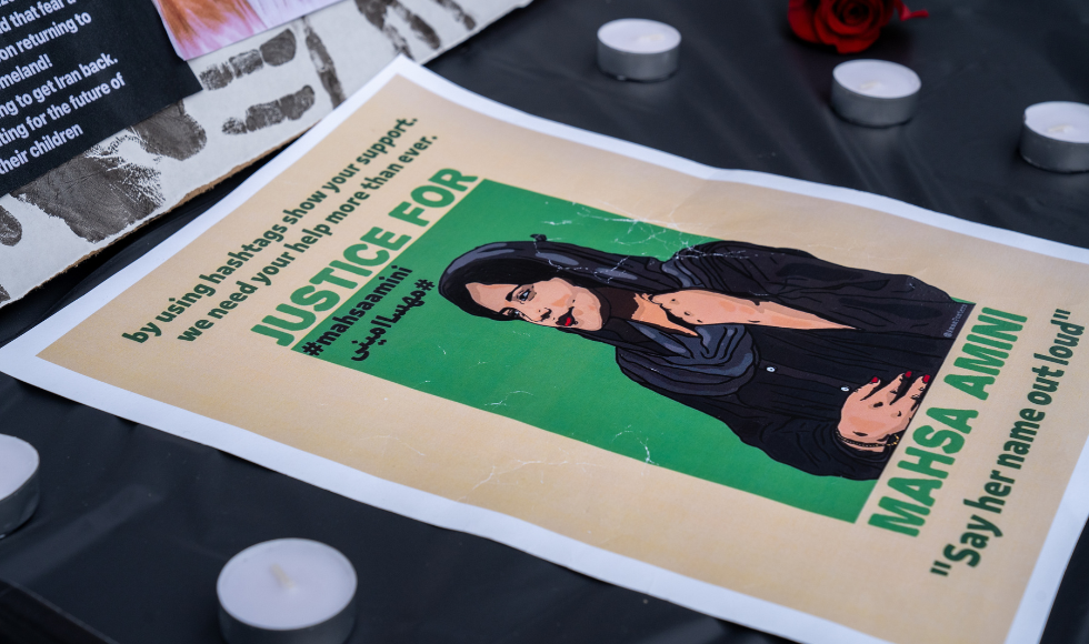 A ’Justice for Mahsa Amini’ poster is displayed at the McMaster Iranian Students Association vigil on Wednesday, September 28 at the McMaster University Student Centre.
